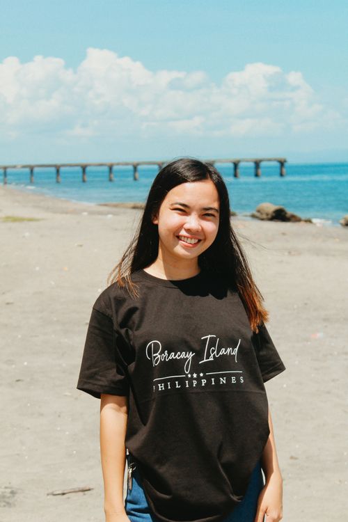 Free A young woman smiling on a sunny day at Boracay Beach, Philippines. Stock Photo