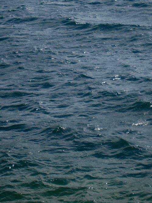 Free Serene sea with gentle waves capturing natural beauty and tranquility. Stock Photo