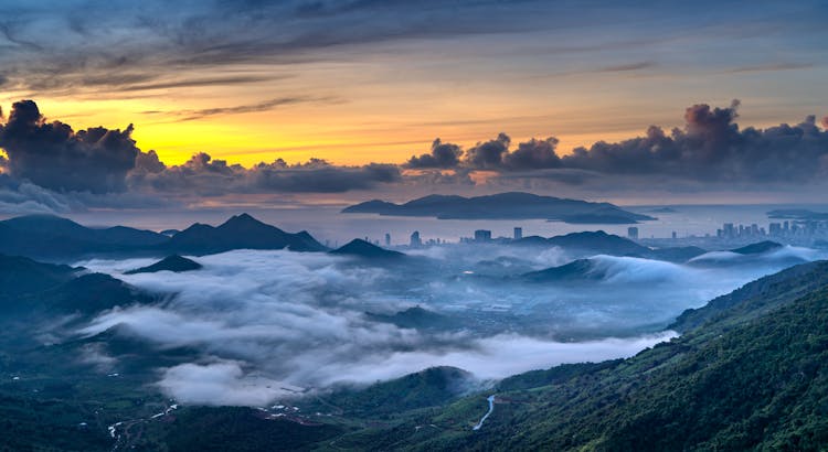 Clouds Over Hills At Sunset