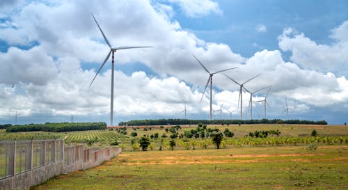 Free A Wind Turbines on Grass Field Stock Photo