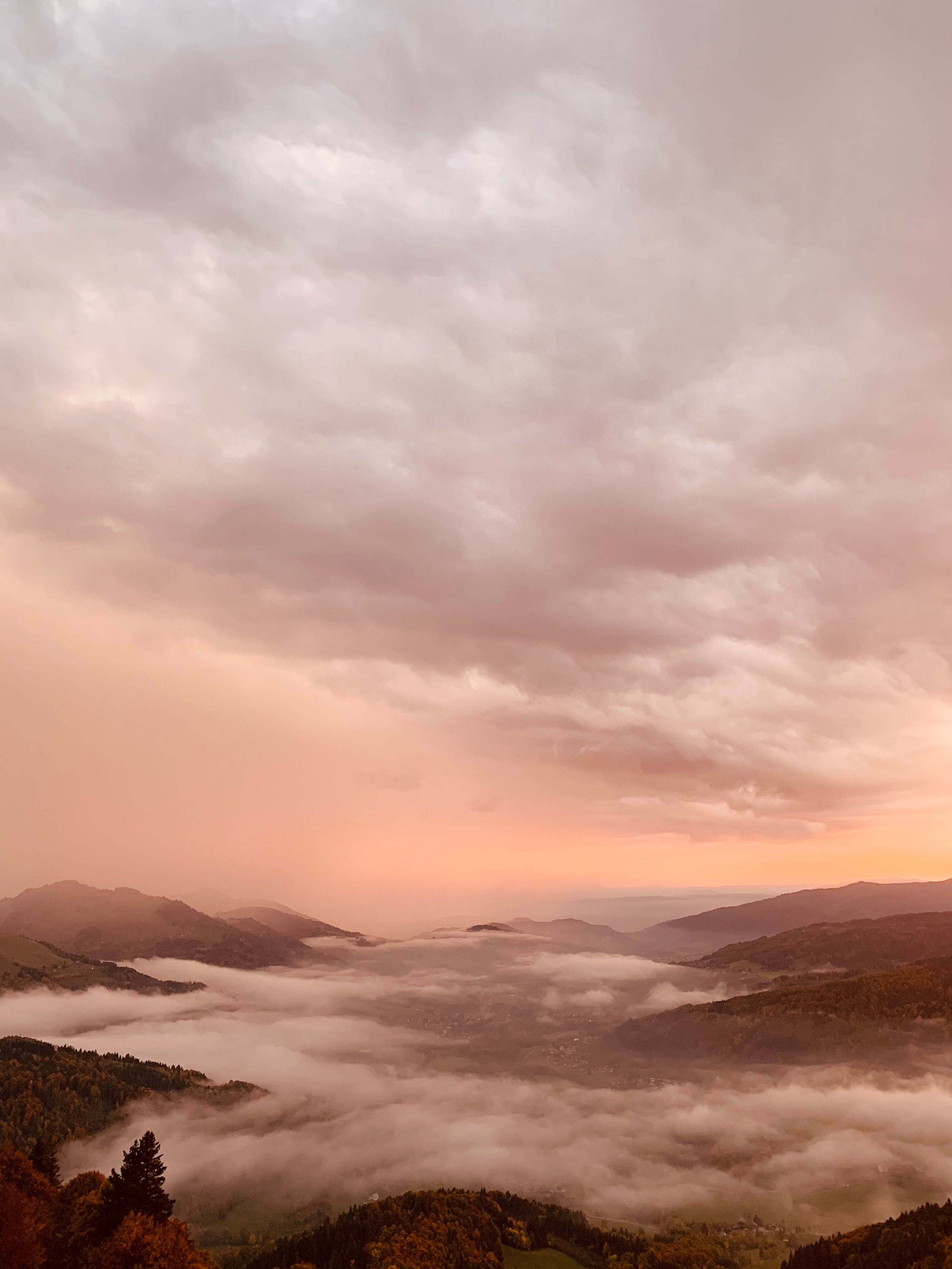 Dramatic mountain landscape with mist and sunrise hues, perfect for nature themes.. pexels, dramatic, mountain