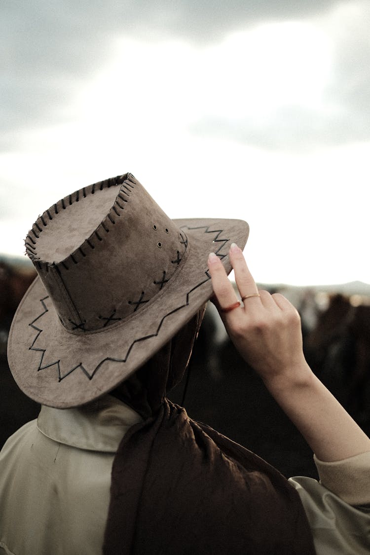 Close-up Of A Person Holding Cowboy Hat