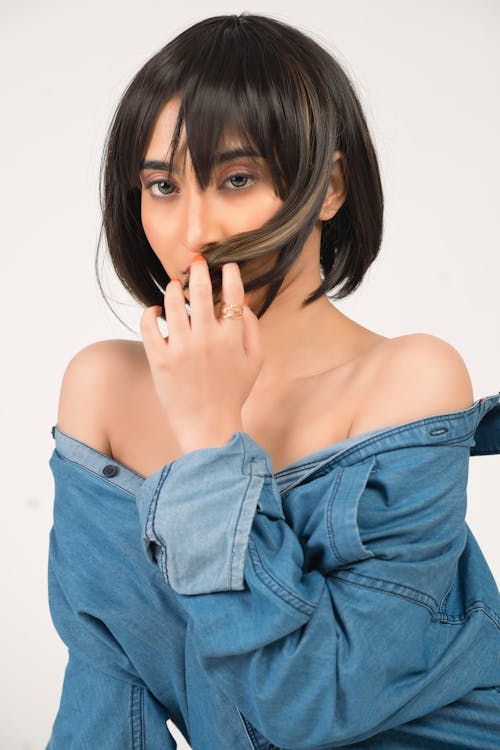 Beautiful Woman in Denim Top Posing