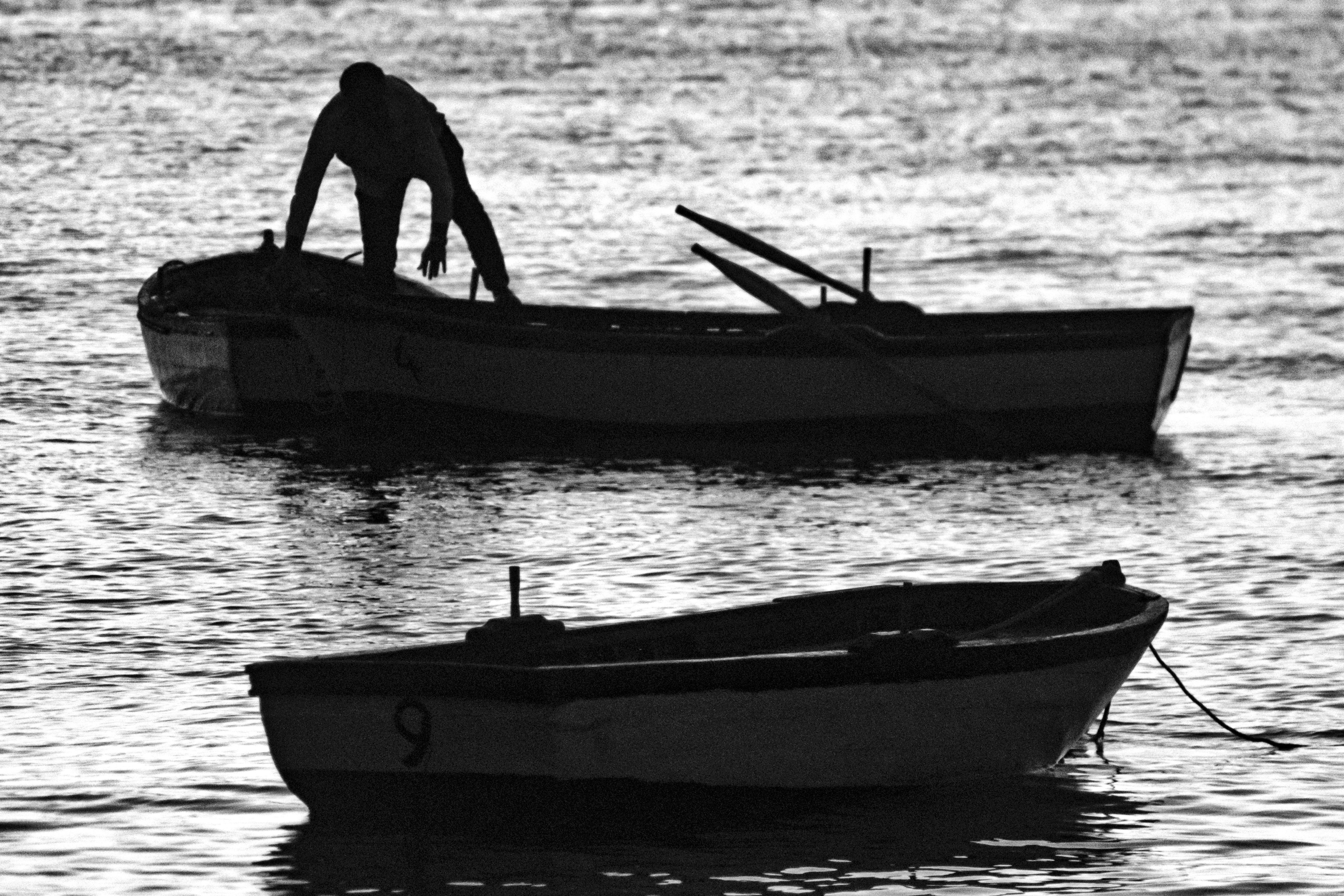 Silhouette of Boats on Water · Free Stock Photo