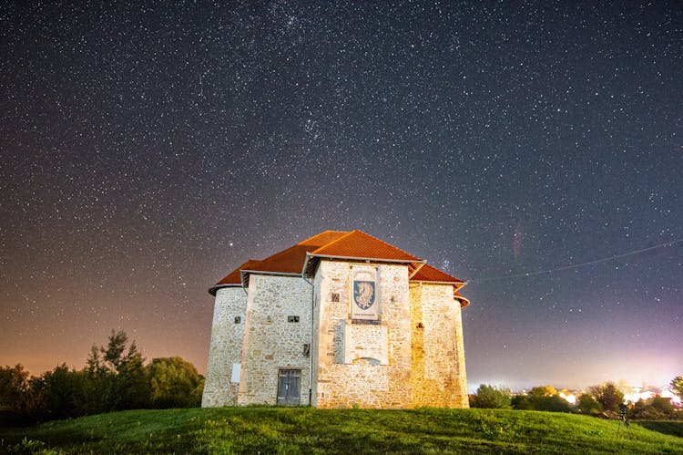 Stone Real Estate Under Stars At Night