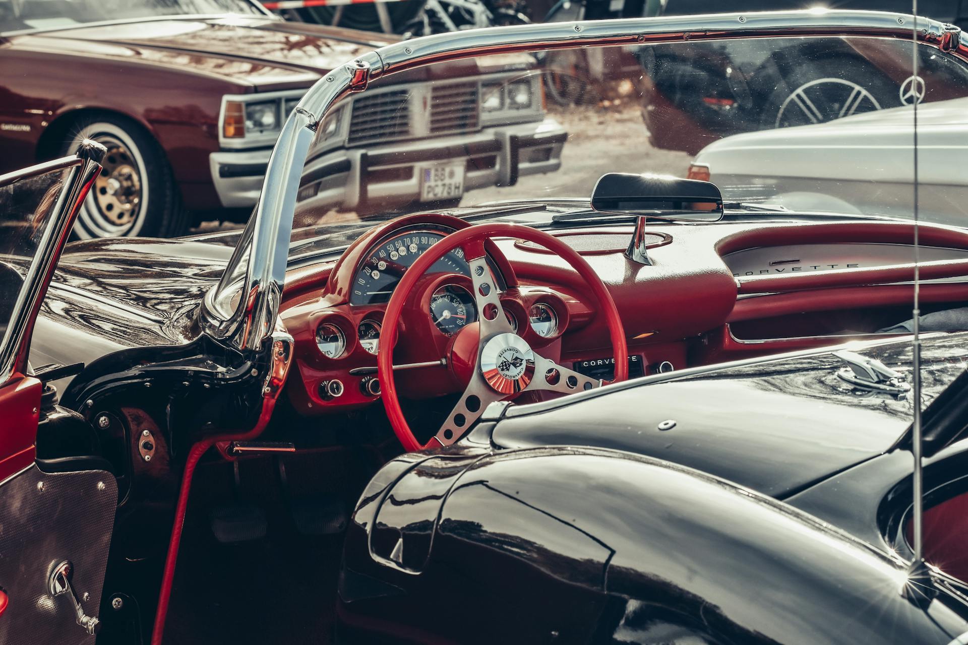 Close-up of a classic Chevrolet Corvette convertible with focus on the detailed interior and dashboard.