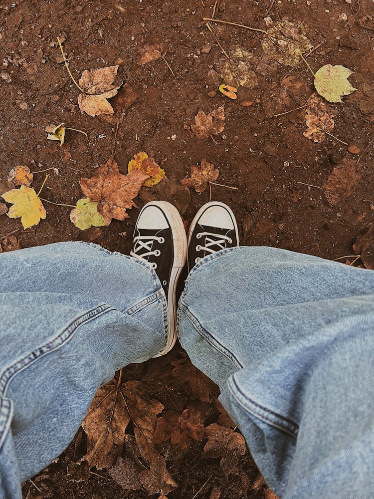 Top View Of A Person Wearing Black Sneakers