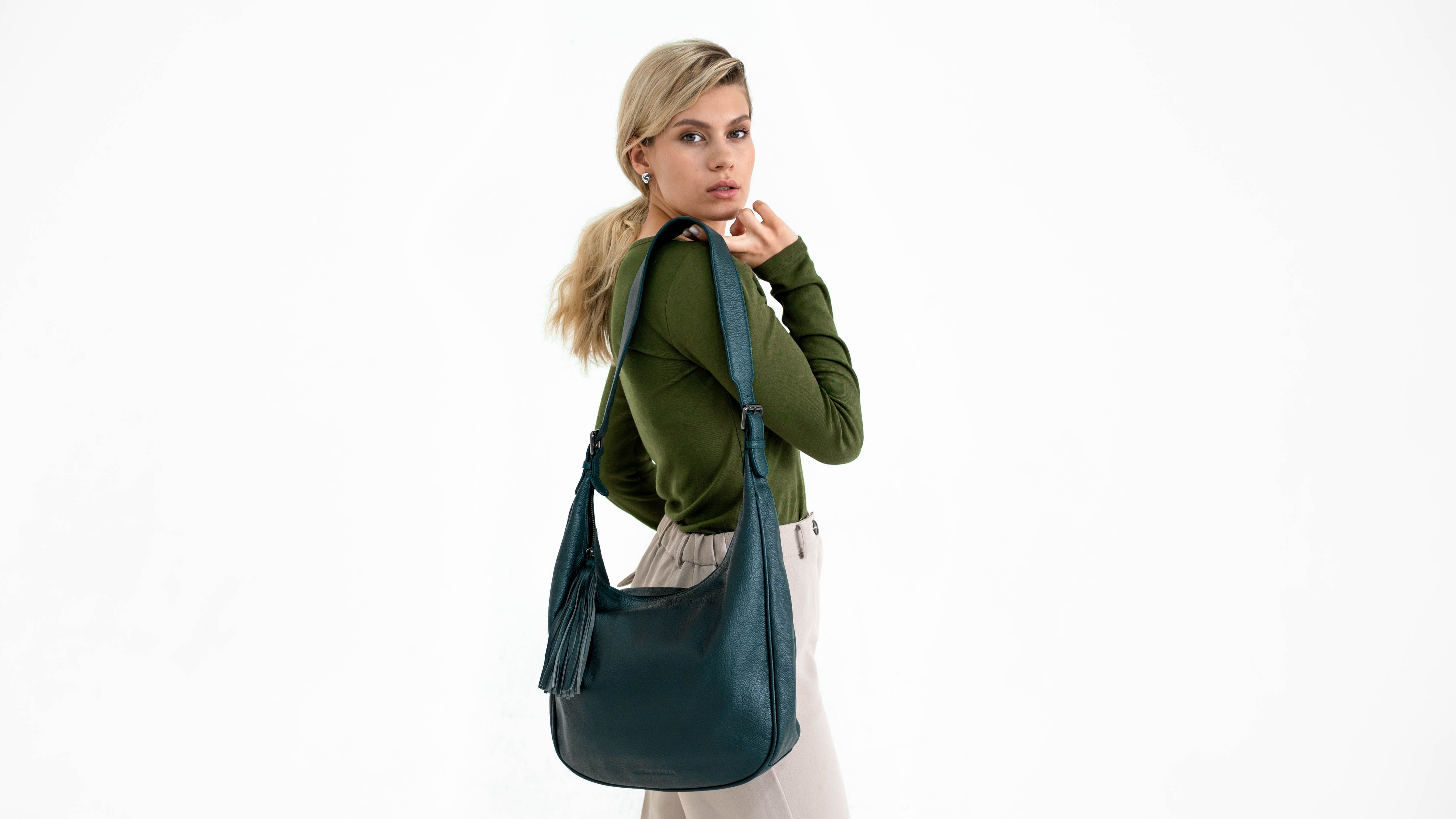 Photo of Woman Holding a Blue Bag · Free Stock Photo