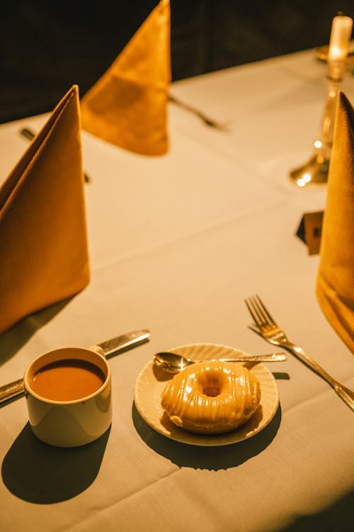 Doughnut and Coffee on a Table 