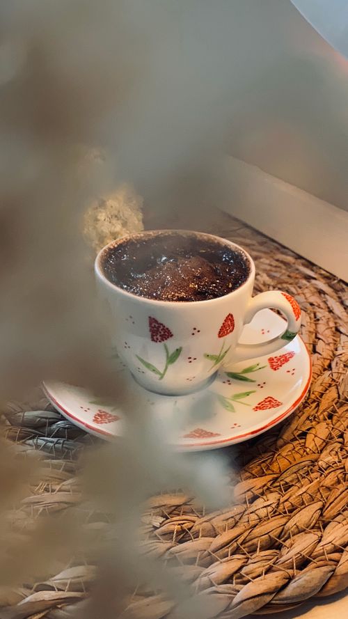 Free Charming coffee cup on a decorative wicker tray, creating a cozy atmosphere. Stock Photo