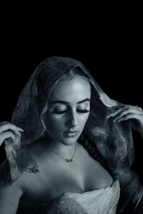 Grayscale Photo of a Beautiful Woman with a Veil