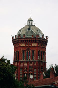 Red brick architectural landmark Phanar Greek Orthodox College in Istanbul dominates the skyline with its domed tower.