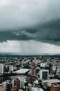 Aerial view of Barranquilla, Colombia with a dramatic stormy sky creating a captivating cityscape.