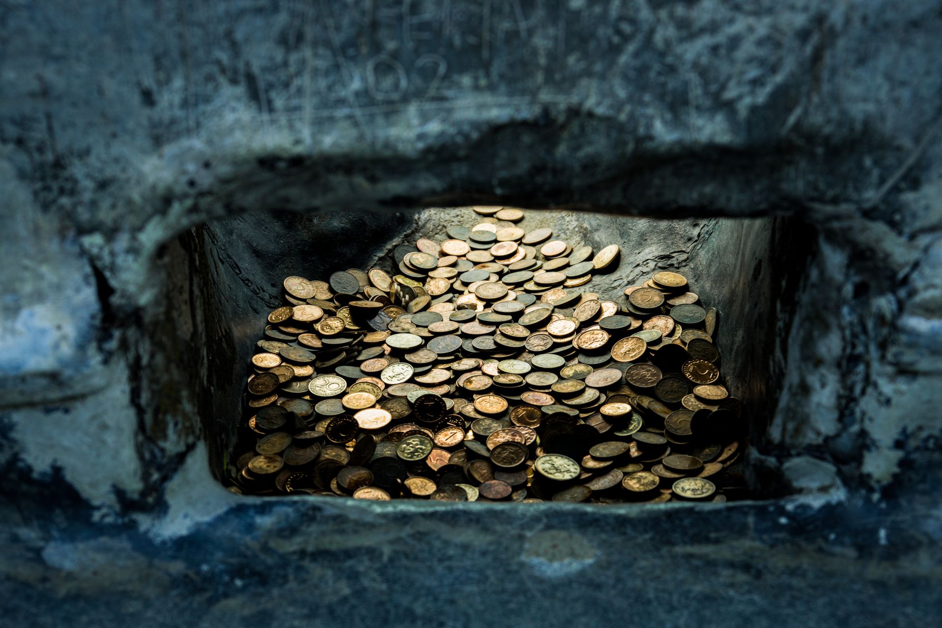 Close-up of Coins on the Stones