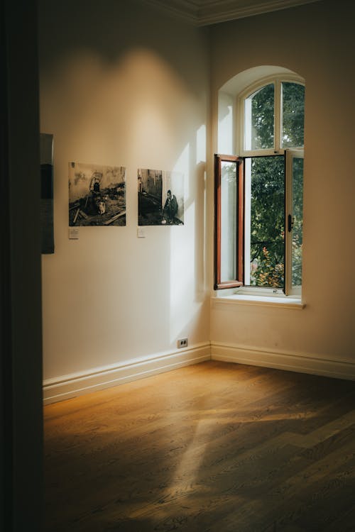 An Open White Wooden Framed Glass Window