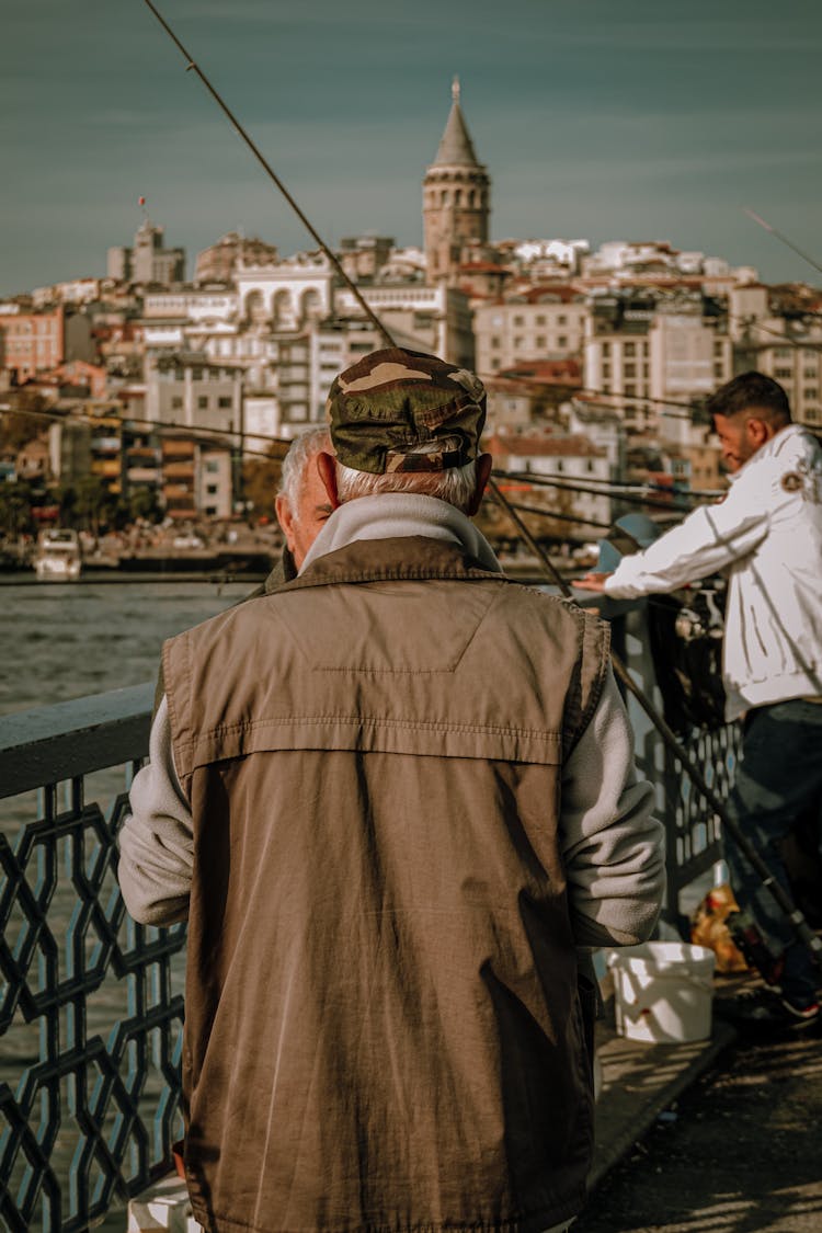 Fishermen Talking On Bridge