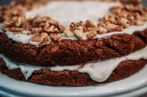 Free Close-up of a delicious homemade cake with walnuts and icing. Stock Photo