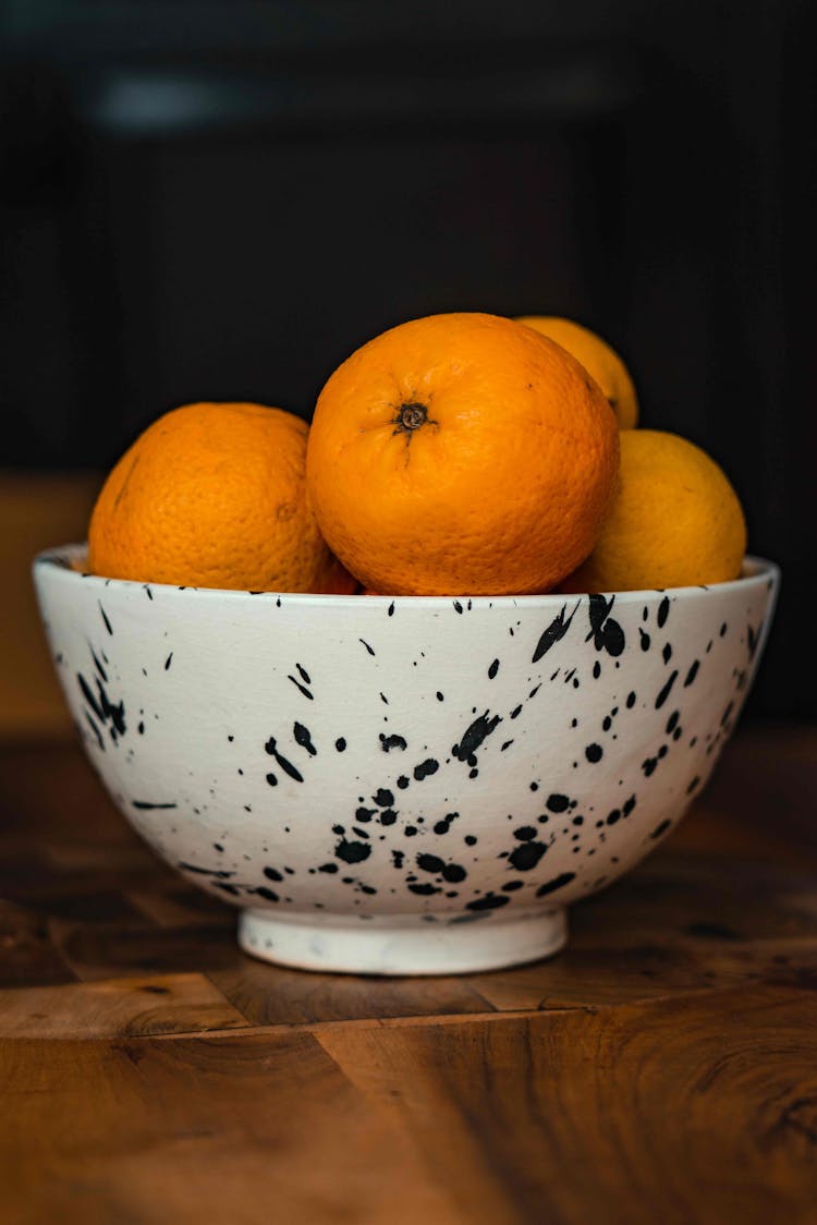 Close-up Of Oranges On A Bowl