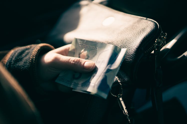 A Person Holding Money