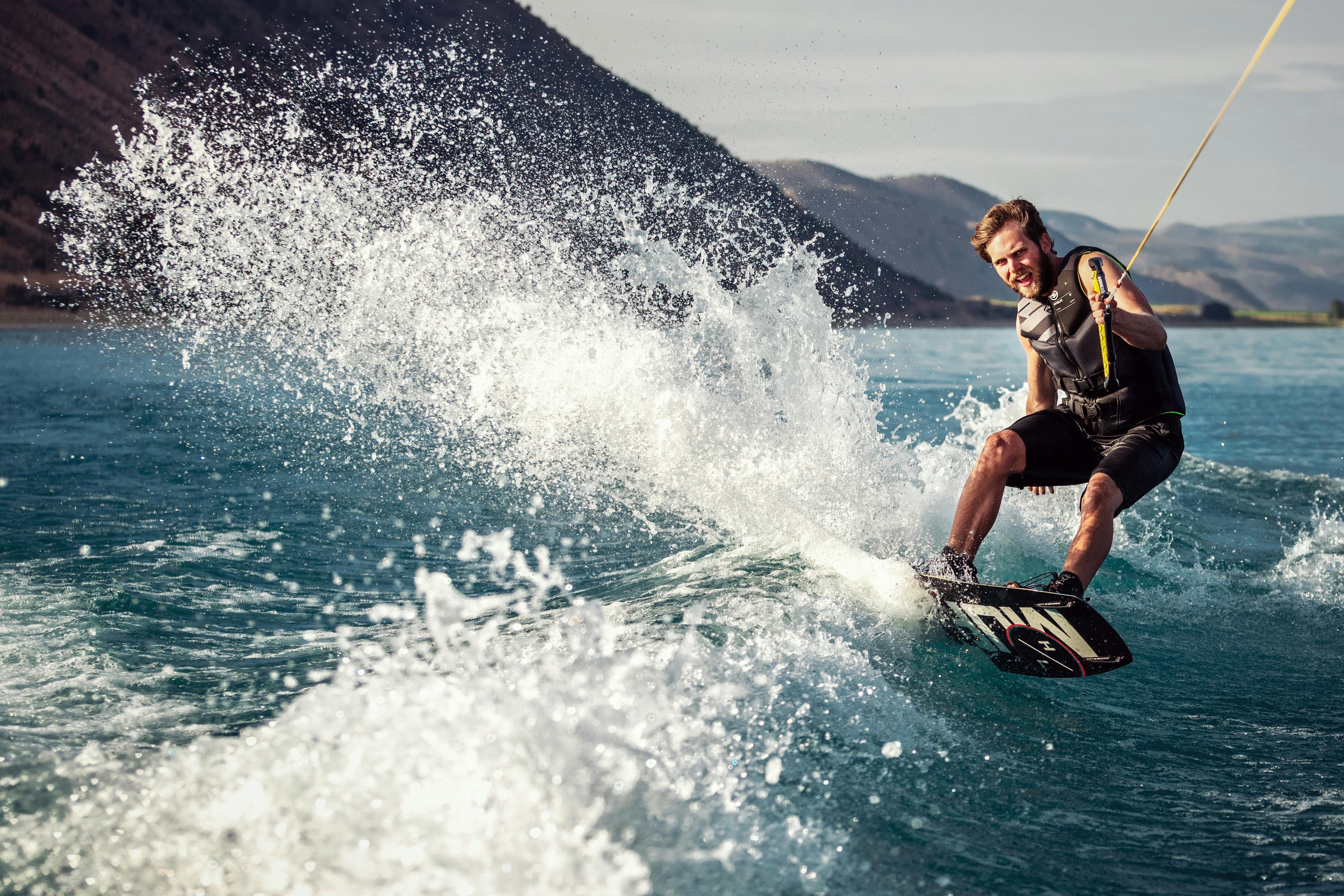 strong man surfing on sea