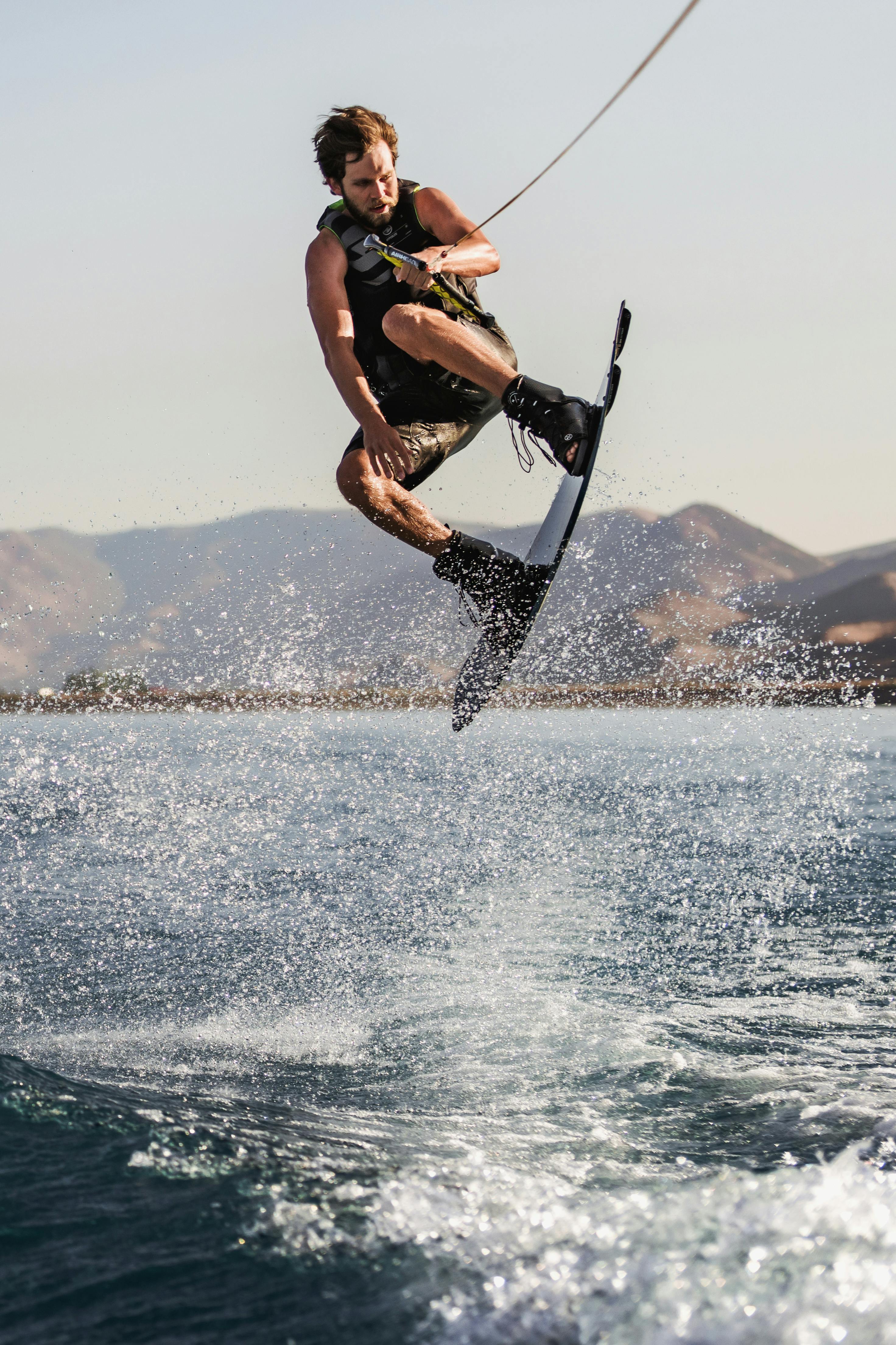 strong man surfing on sea