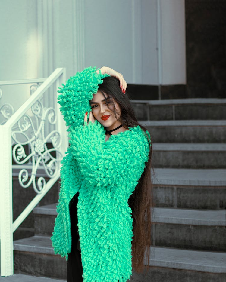 A Woman Wearing A Green Fur Jacket