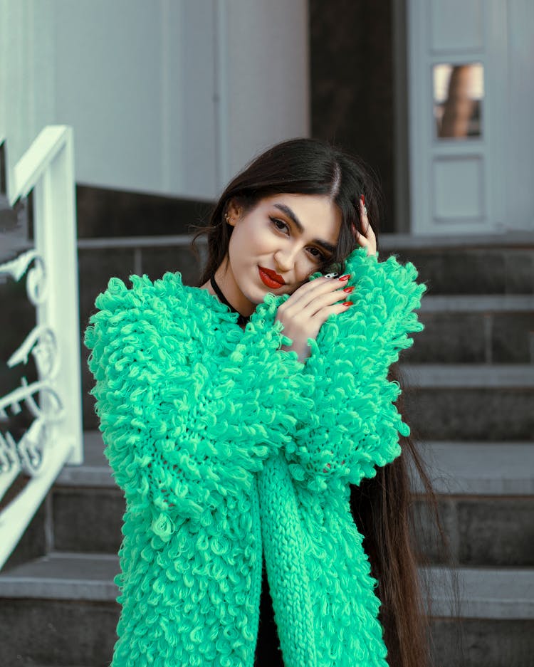 A Woman Wearing A Green Fur Jacket