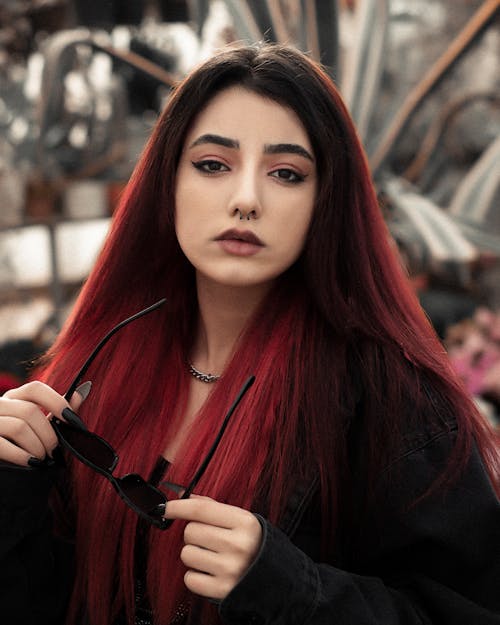 Woman in Black Long Sleeve Shirt with Red Hair