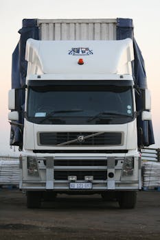 A powerful white truck captured from the front, showcasing its robust design.