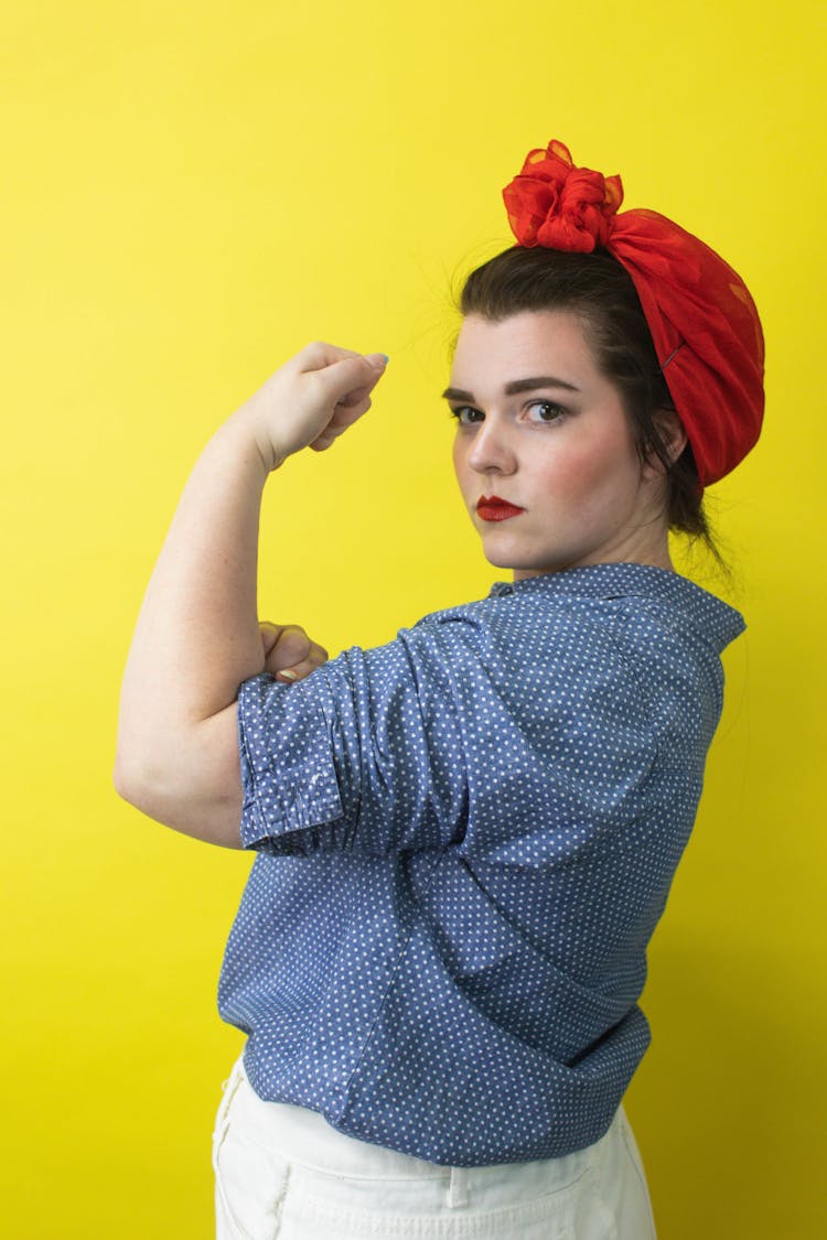 Woman In Polka Dot Shirt Wearing Red Head Wrap