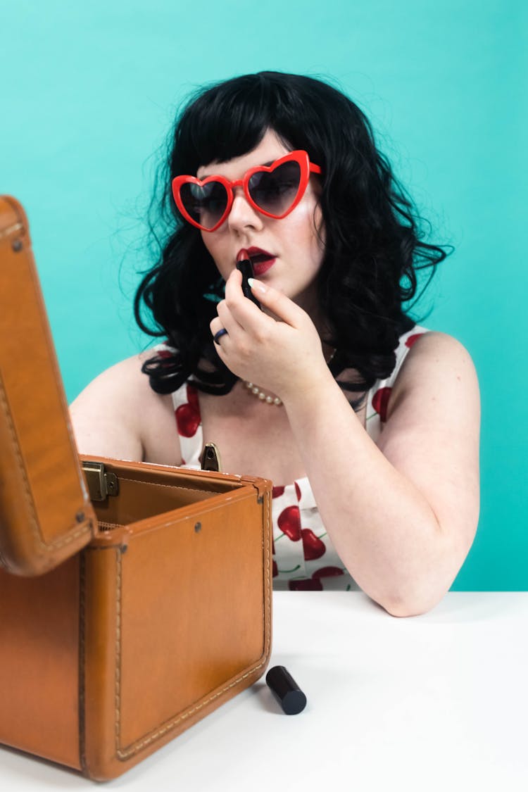 A Woman Using Lipstick