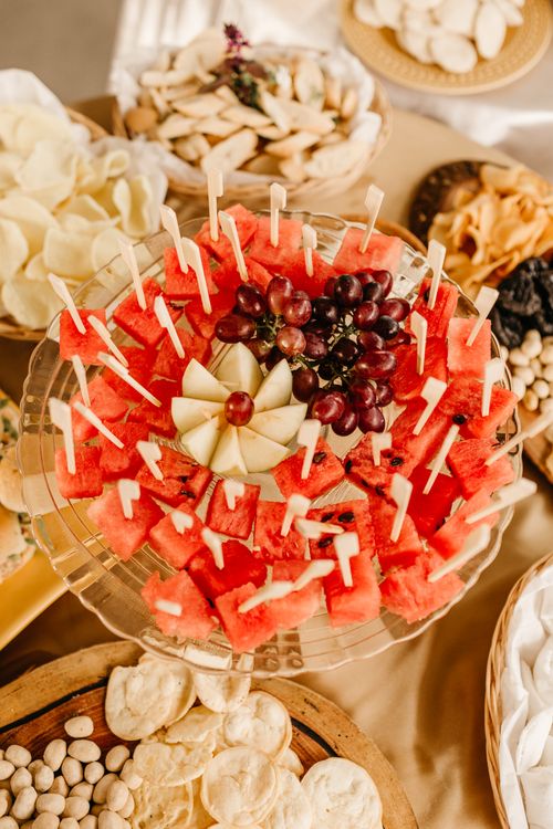 Free Vibrant fruit platter featuring watermelon, grapes, cheese, and assorted snacks, perfect for parties. Stock Photo