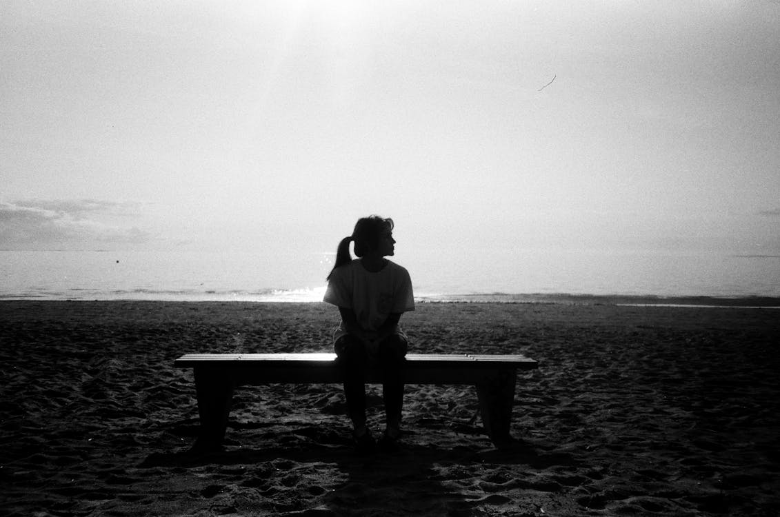 Woman Sitting On Bench