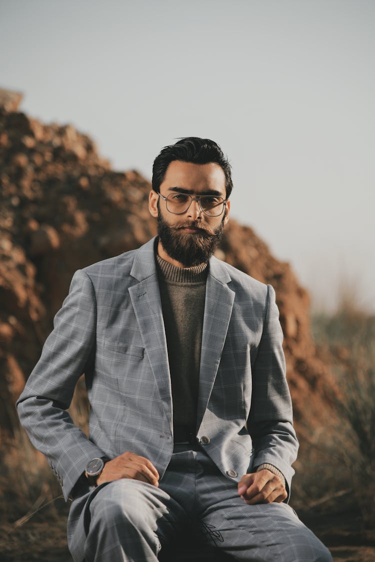 Stylish Bearded Man In Suit And Glasses