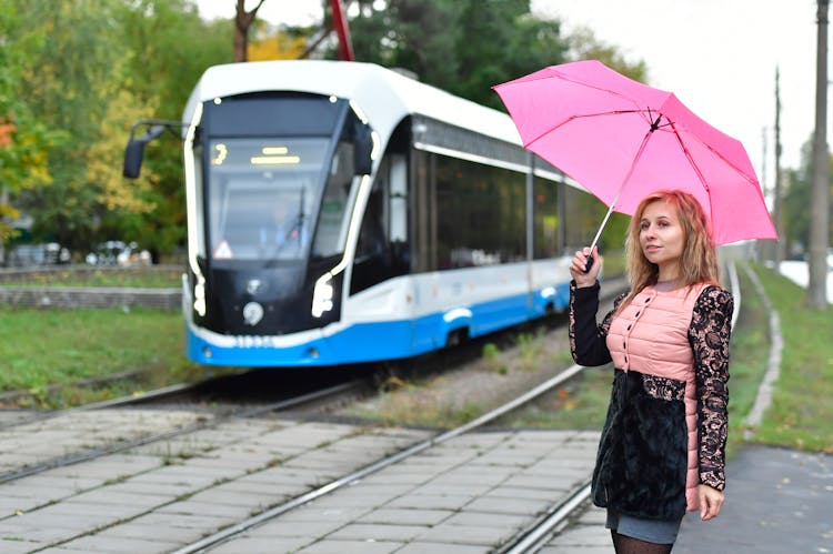 A Woman Standing Near On The Train