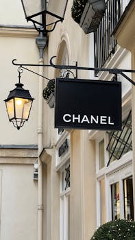 Chanel store sign with elegant lantern, highlighting luxury retail ambience.