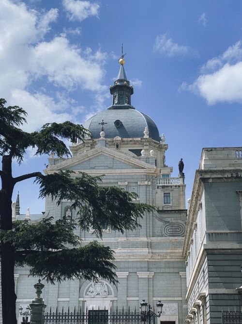 Free Stunning view of Madrid's Almudena Cathedral under a bright blue sky. Stock Photo