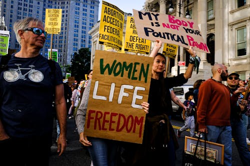 People with Protest Signs Demonstrating in the City Street 