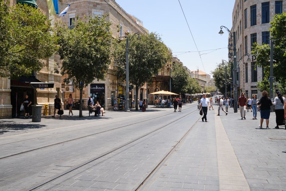 Jerusalem Light Rail (Red Line) tram moving through a city street in Israel