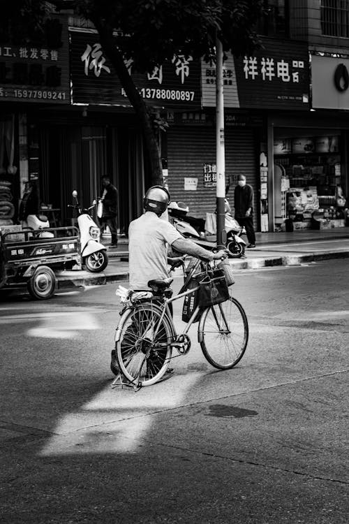 Free Man Walking with His Bike Stock Photo