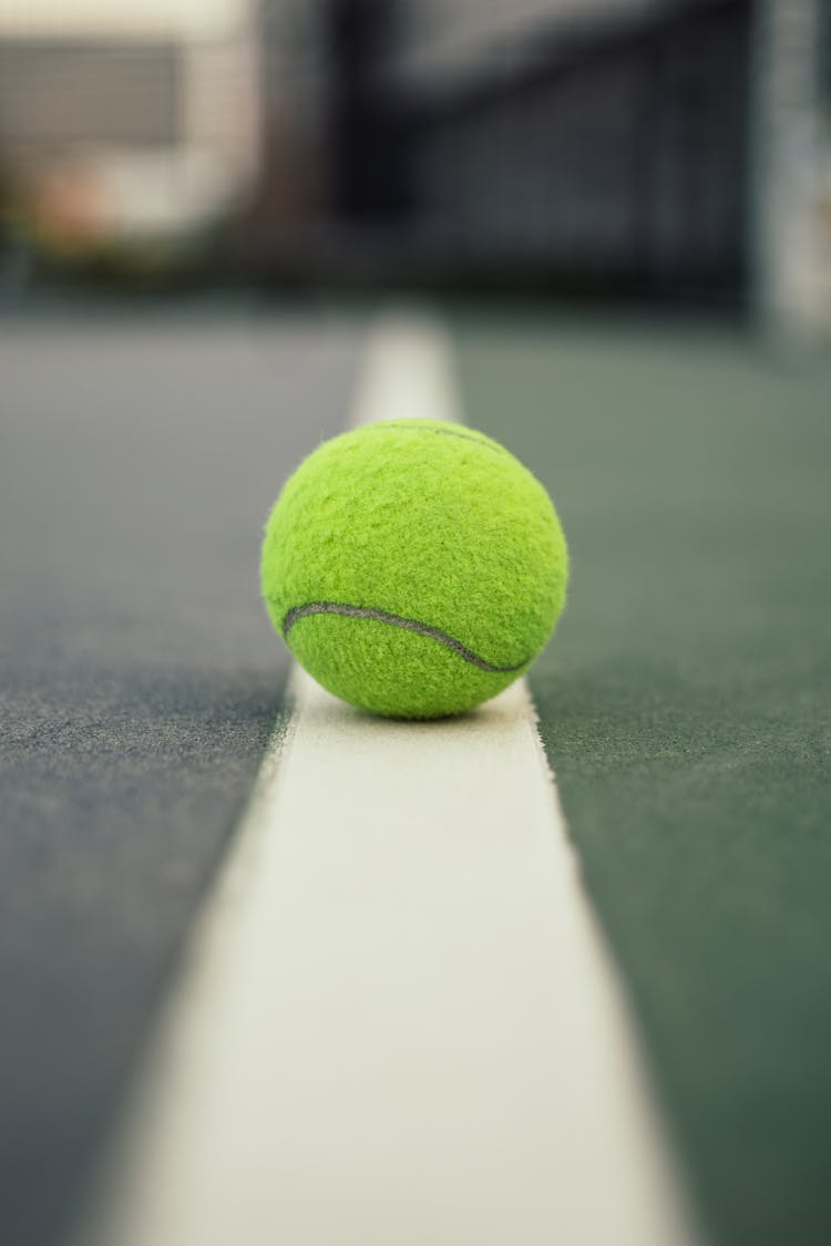 Green Tennis Ball On Court