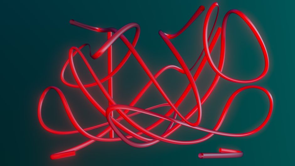 Vibrant neon red tubes on a dark background, creating an abstract, futuristic design.