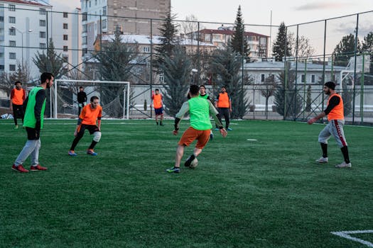Casual soccer game on an outdoor field in İstanbul, Türkiye, showcasing teamwork and sportsmanship.