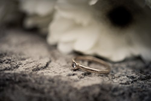 Selective Focus Photography Of Silver Ring