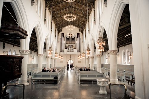 Free Interior view of a grand cathedral with beautiful arches, columns and organ pipes. Stock Photo