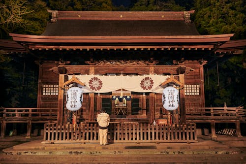 A Person Praying at a Temple