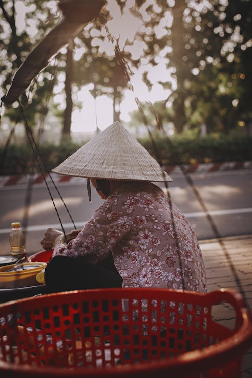 Woman Sitting behind Basket