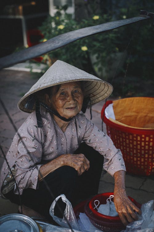 Elderly Woman Selling on the Street