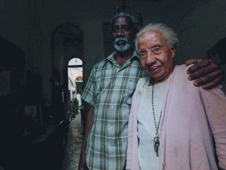 An Elderly Couple Inside Their Home