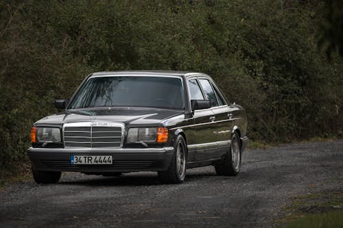 Black Mercedes Benz Parked on Dirt Road